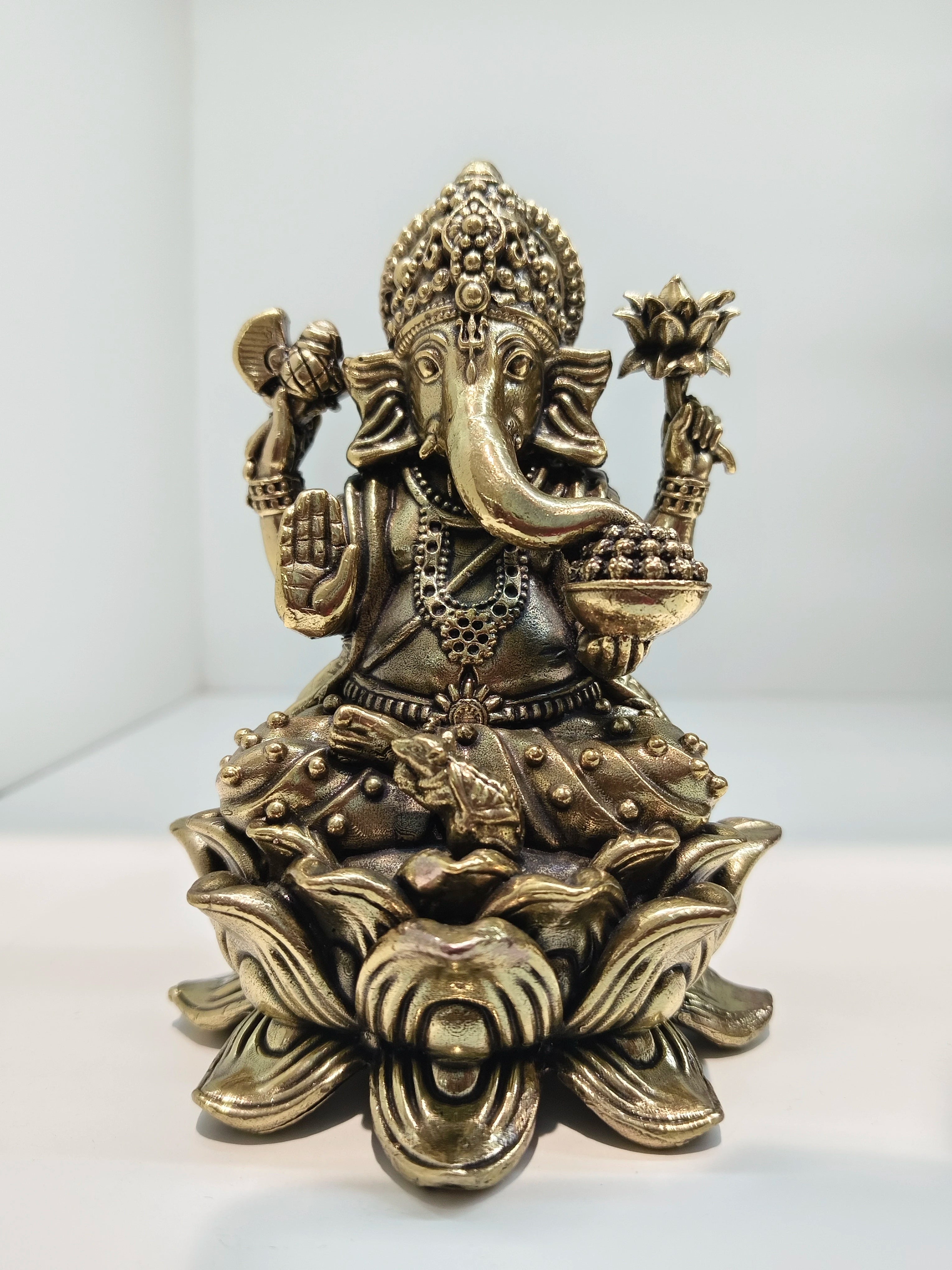 Mini brass Padmasana Ganapati statue sitting on a lotus base, front view