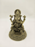 Brass Padma Hasta Ganapati statue with intricate detailing seated on decorative base