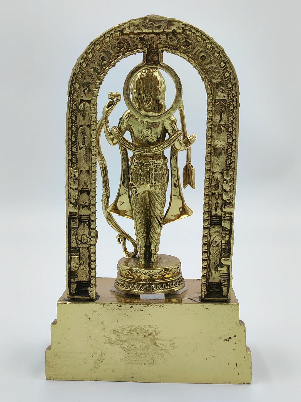 Back view of brass Ayodhya Rama sculpture with ornate arch and bow