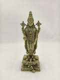 Front view of a detailed brass Balaji statue standing on a decorated base
