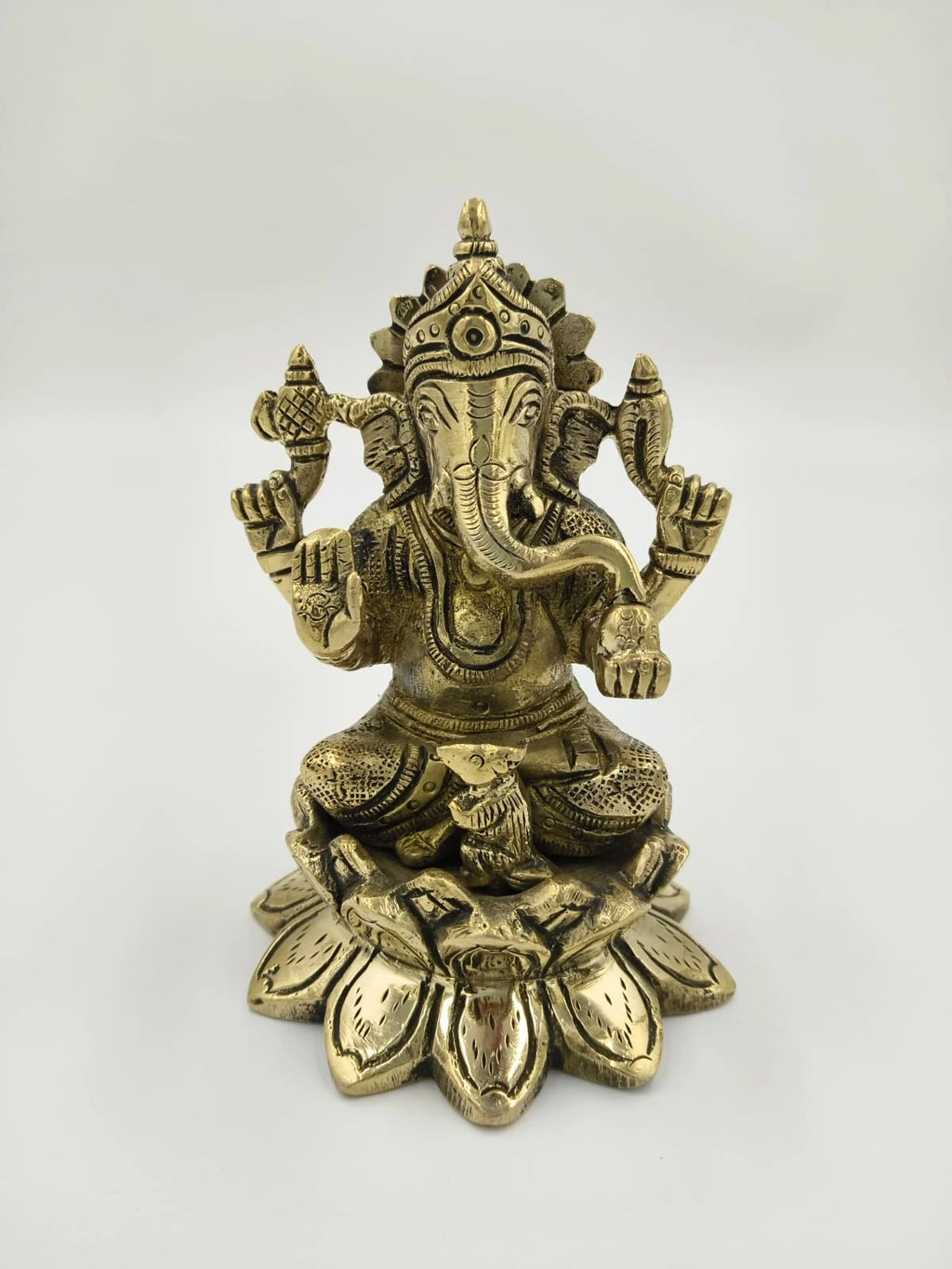 Brass statue of Padma Hasta Ganapati seated on a lotus pedestal