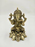 Brass statue of Padma Hasta Ganapati seated on a lotus pedestal