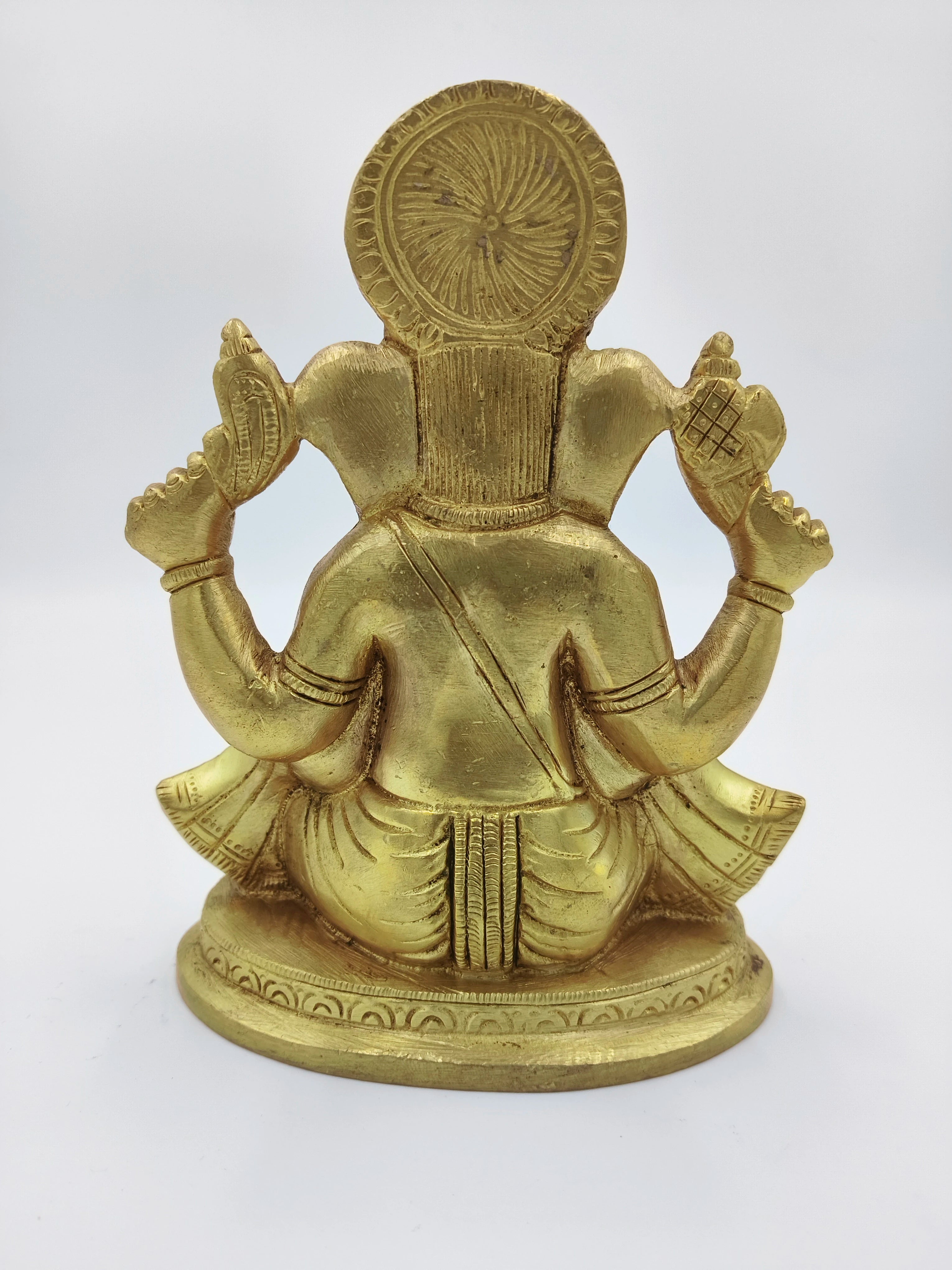 Back view of medium brass Padmasana Ganapati statue in seated posture