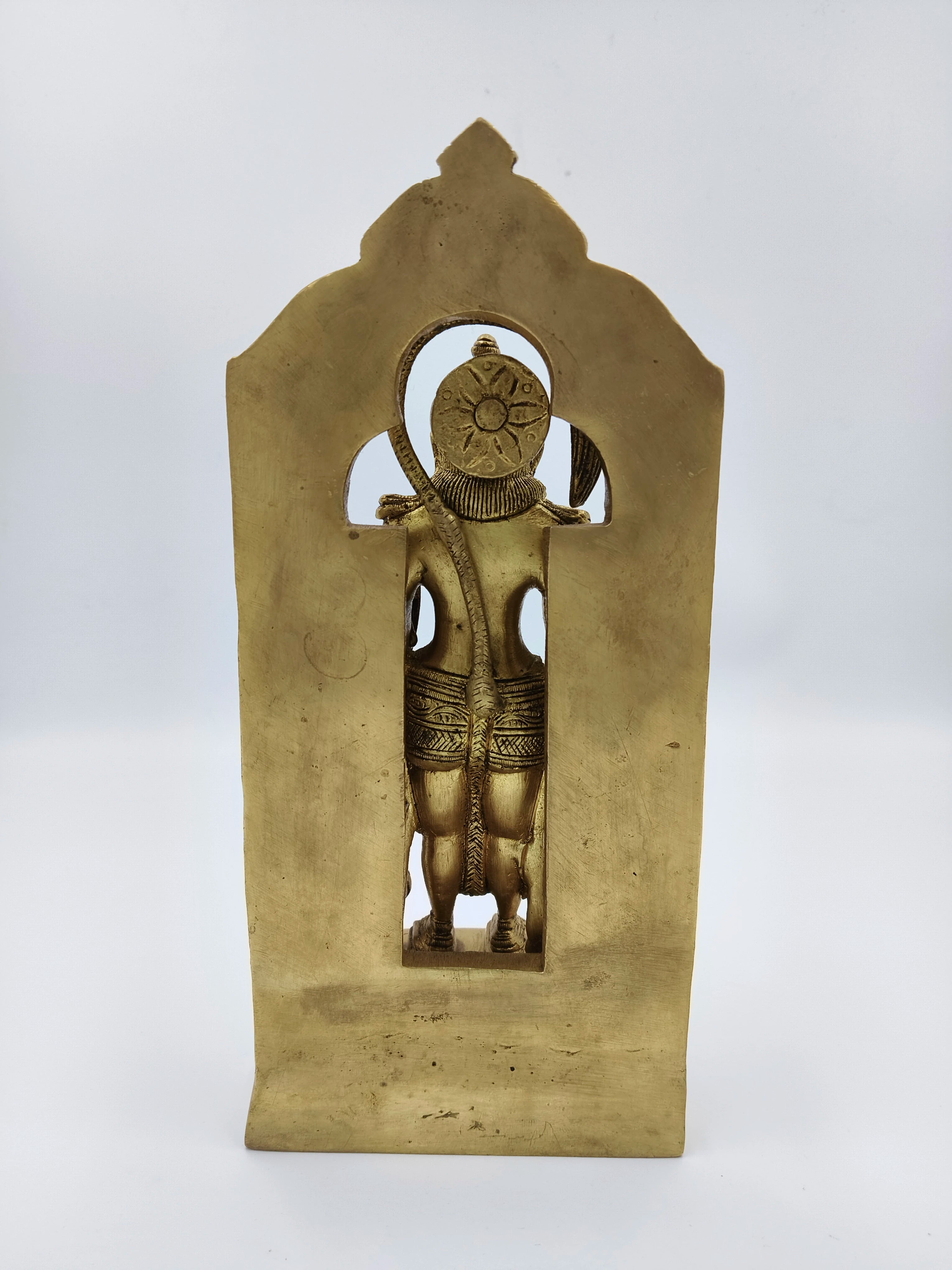 Back view of large brass standing Hanuman sculpture with arch frame