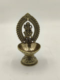 Medium brass sculpture of Lord Ganesha within decorative arch on pedestal bowl