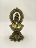Brass decorative arch with Lakshmi idol and deep diya holder