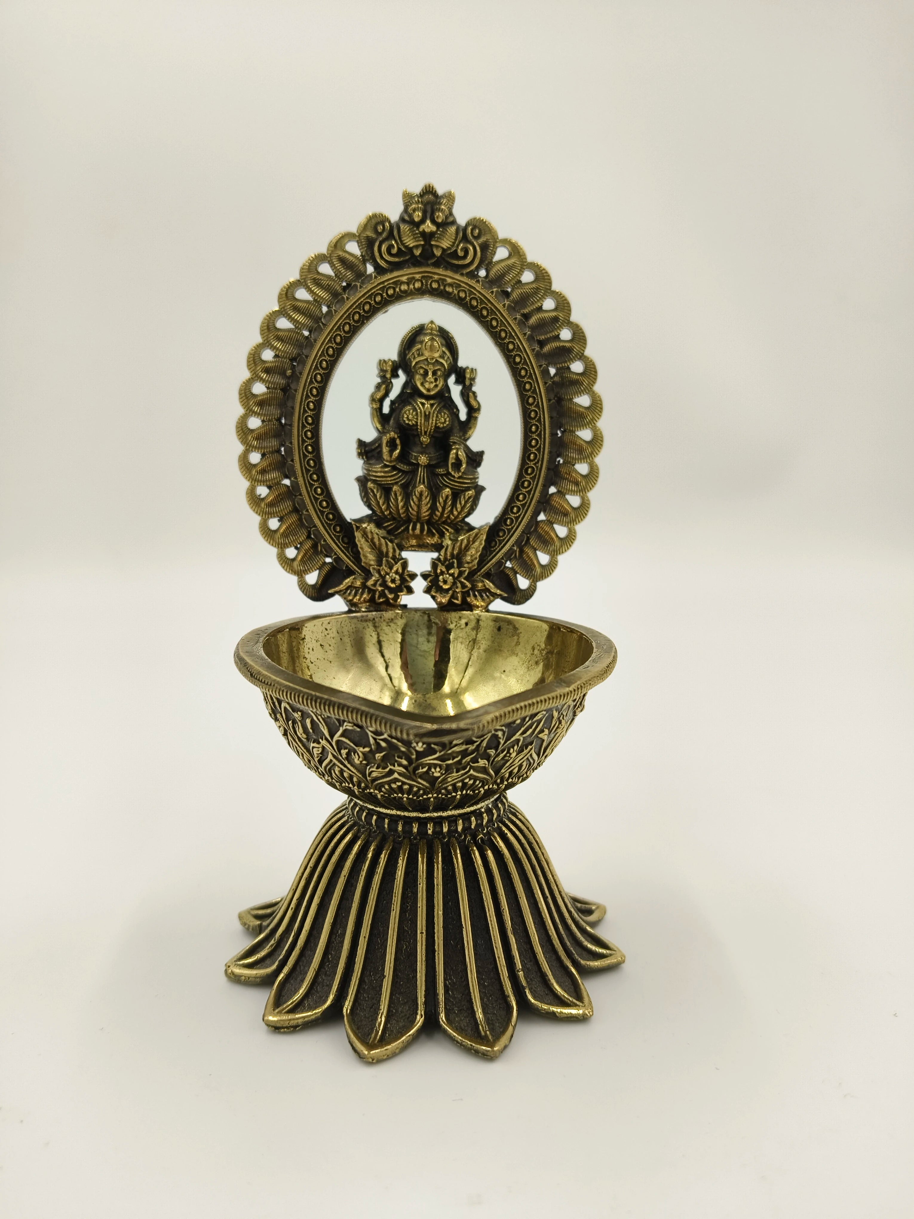 Brass decorative arch with Lakshmi idol and deep diya holder