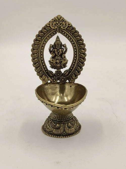 Medium brass Lakshmi idol with decorative arch and bowl base