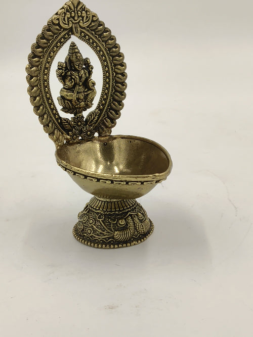 Brass arch Lakshmi deep with detailed base and oval shaped oil holder