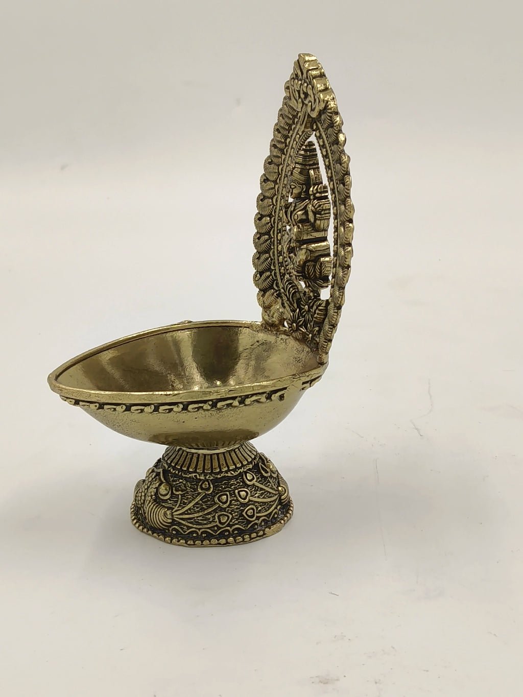 Brass Lakshmi deep oil lamp with decorative arch and floral base