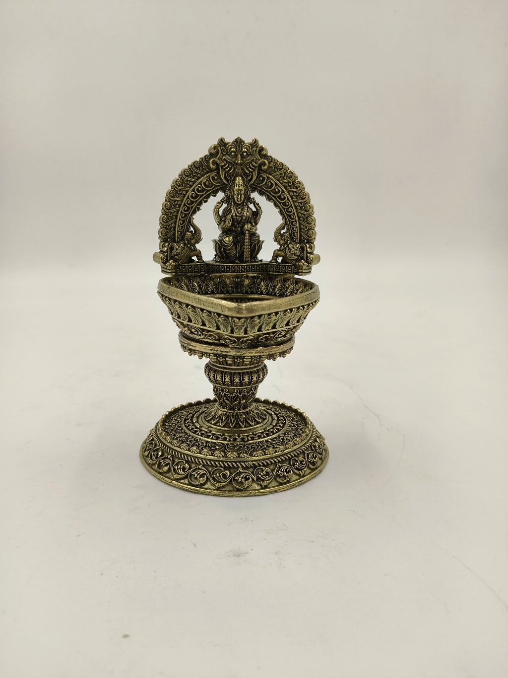 Medium brass sculpture of Arch Lakshmi Deep with intricate detailing