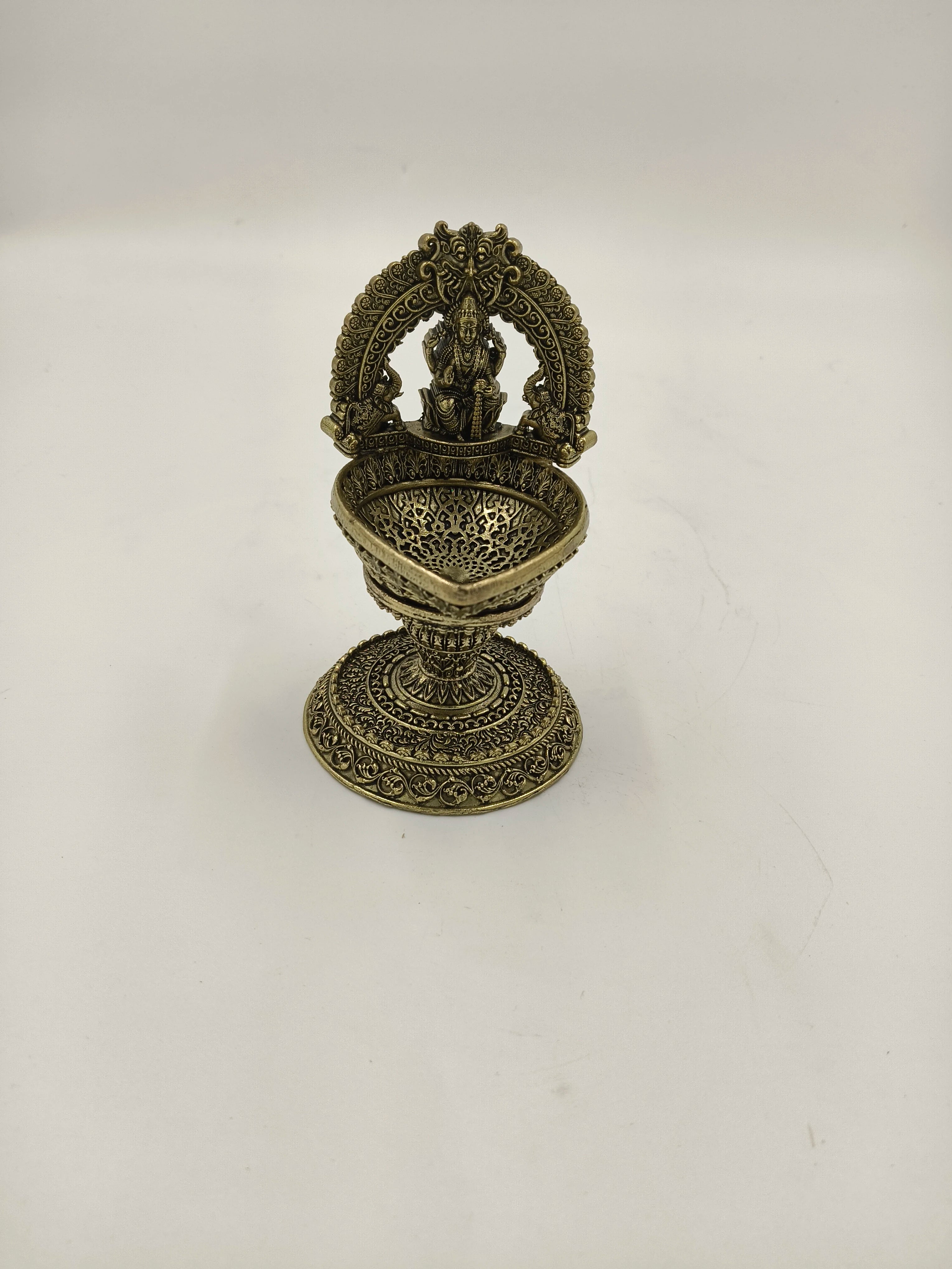 Medium brass Lakshmi idol with decorative arch and deep bowl base