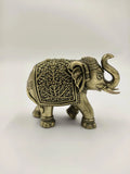 Mini brass elephant sculpture with intricate floral patterns side view