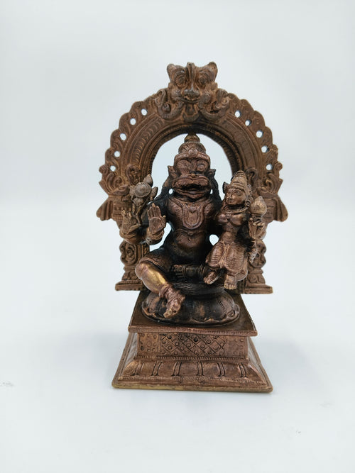 Medium copper sculpture of Narasimha Swami seated under ornamental arch