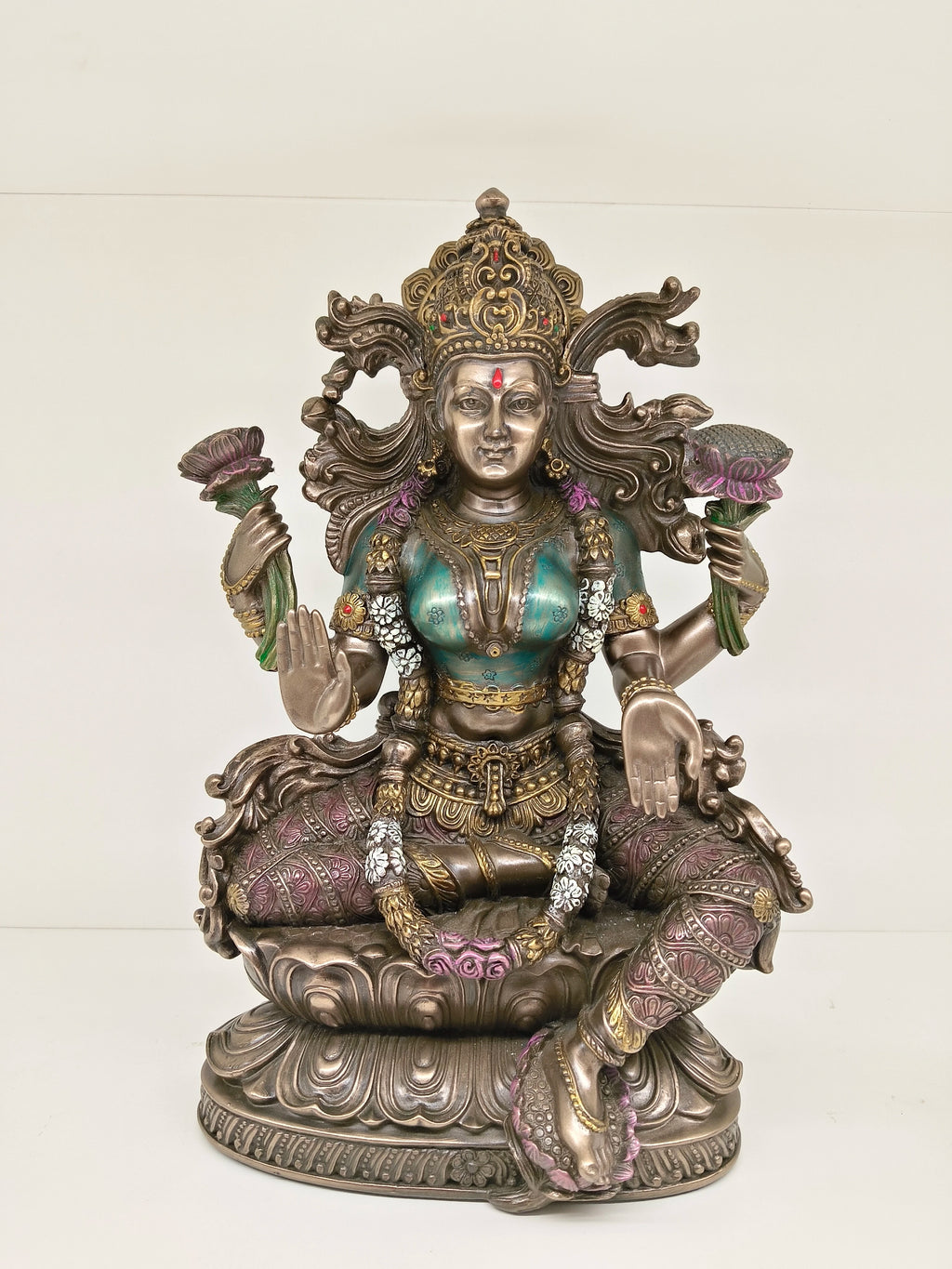 Large polyresin statue of Goddess Lakshmi seated on lotus with four arms