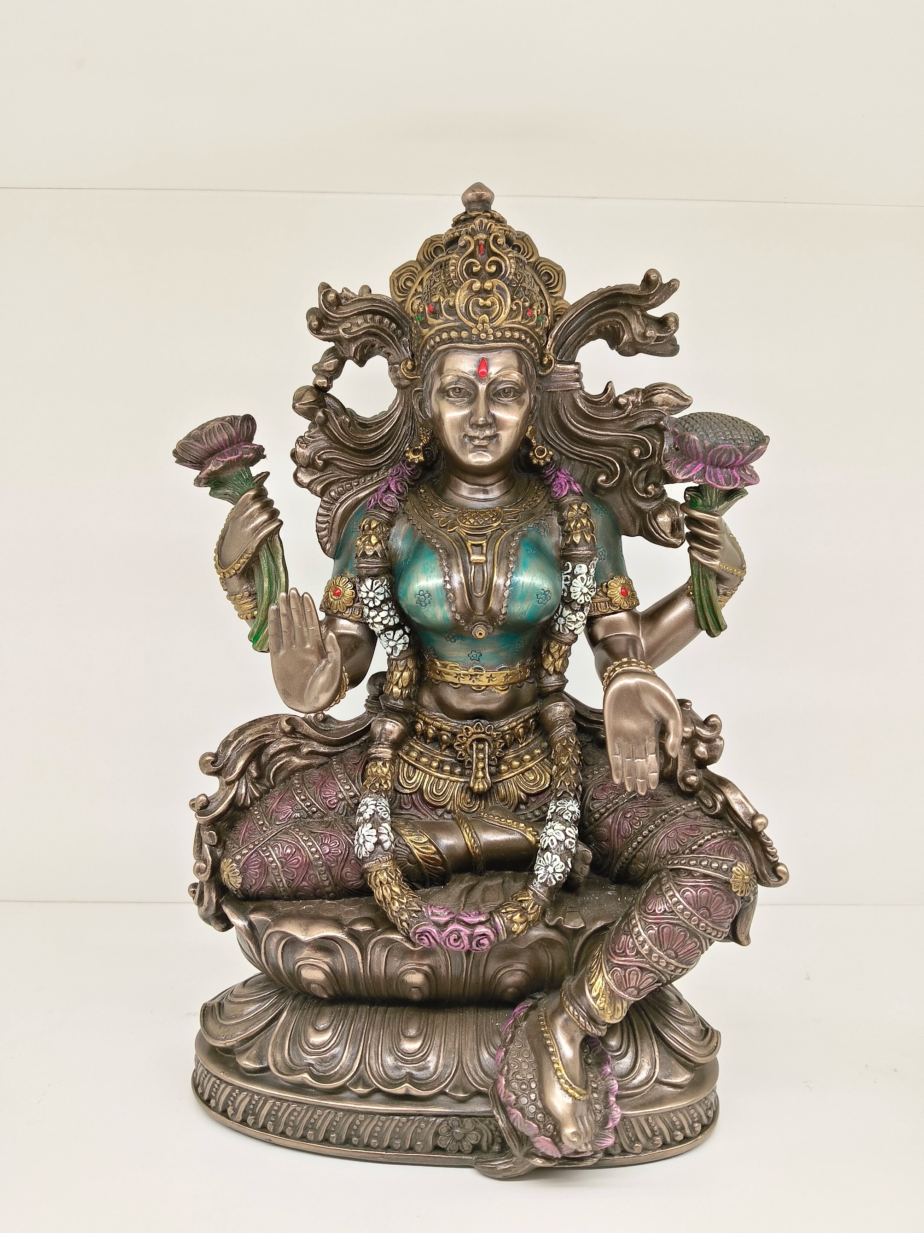Large polyresin statue of Goddess Lakshmi seated on lotus with four arms