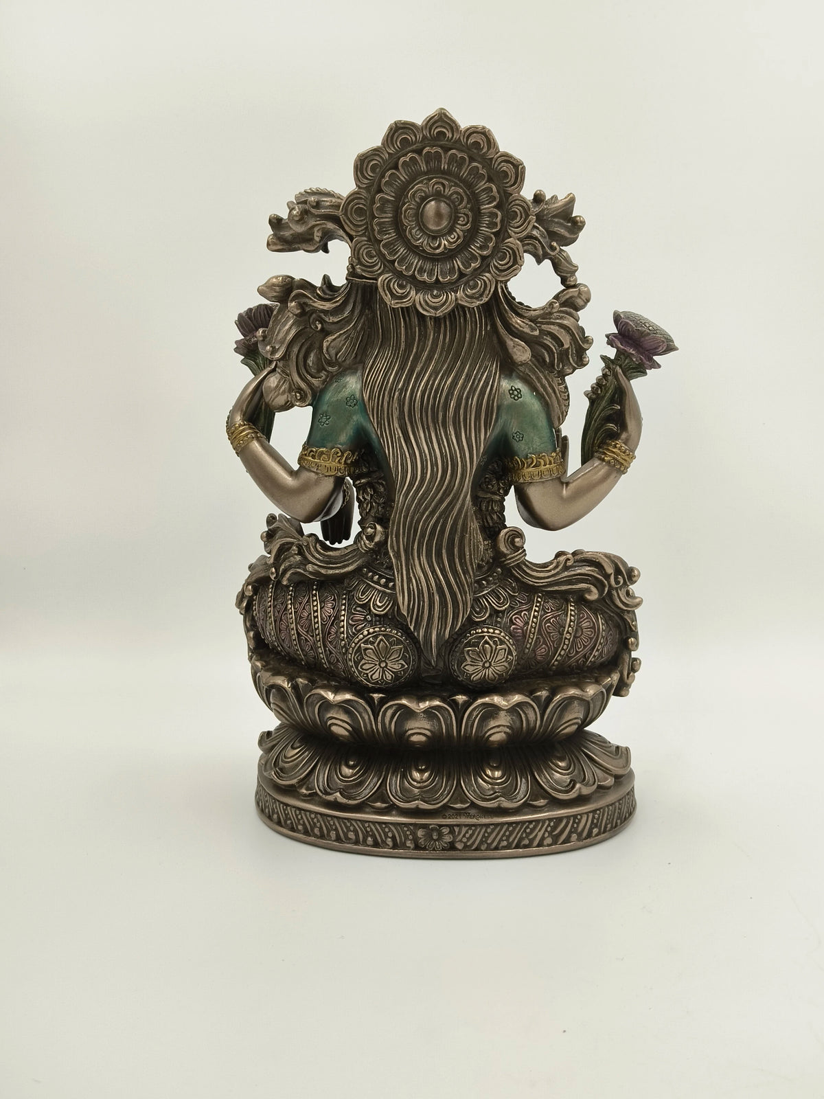 Back view of large polyresin statue of Goddess Lakshmi seated on lotus