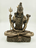 Large polyresin sculpture of Shiva seated in lotus pose with trident and drum