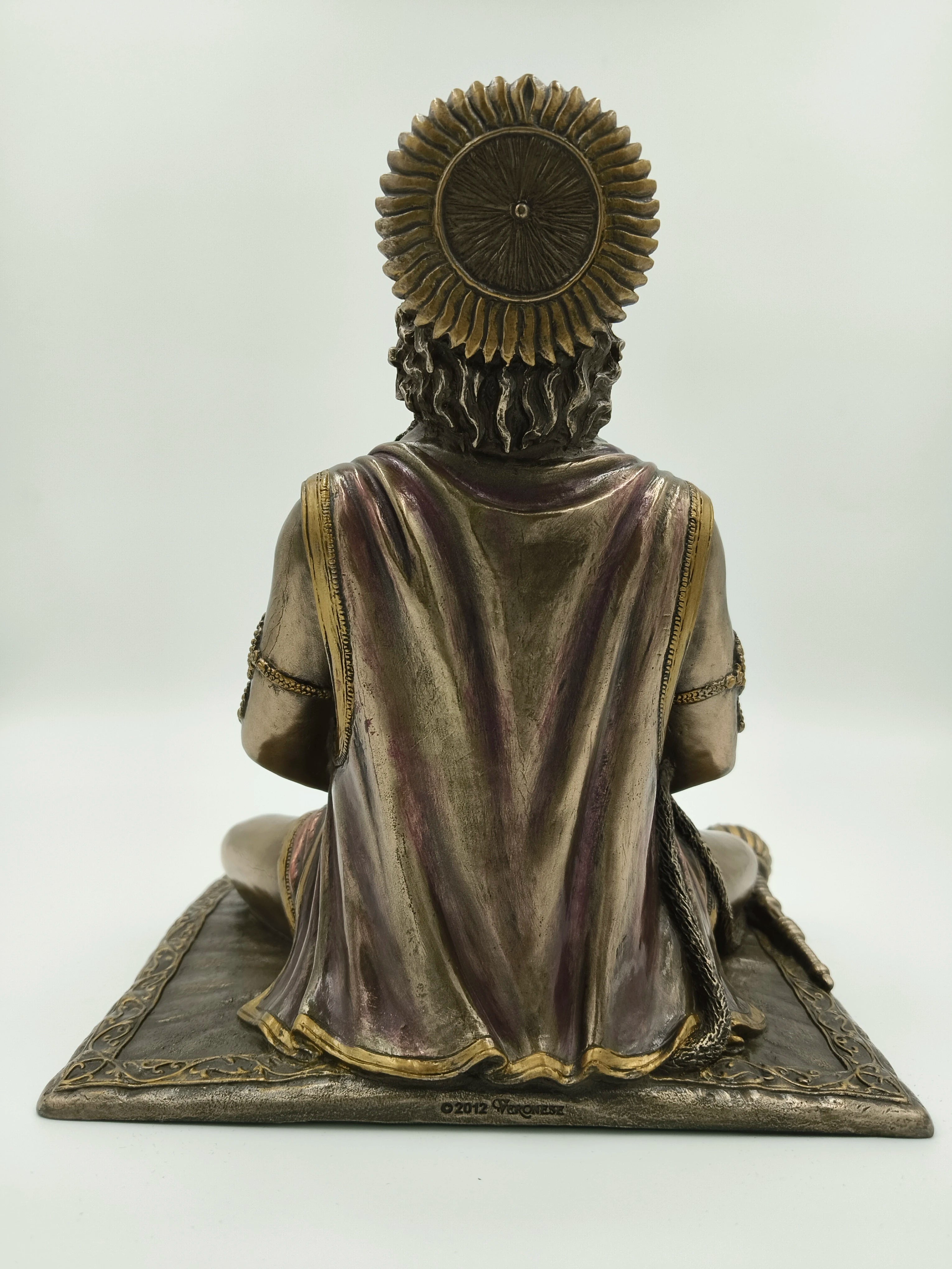 Rear view of polyresin Hanuman sculpture seated in Dhyan Mudra on decorated base