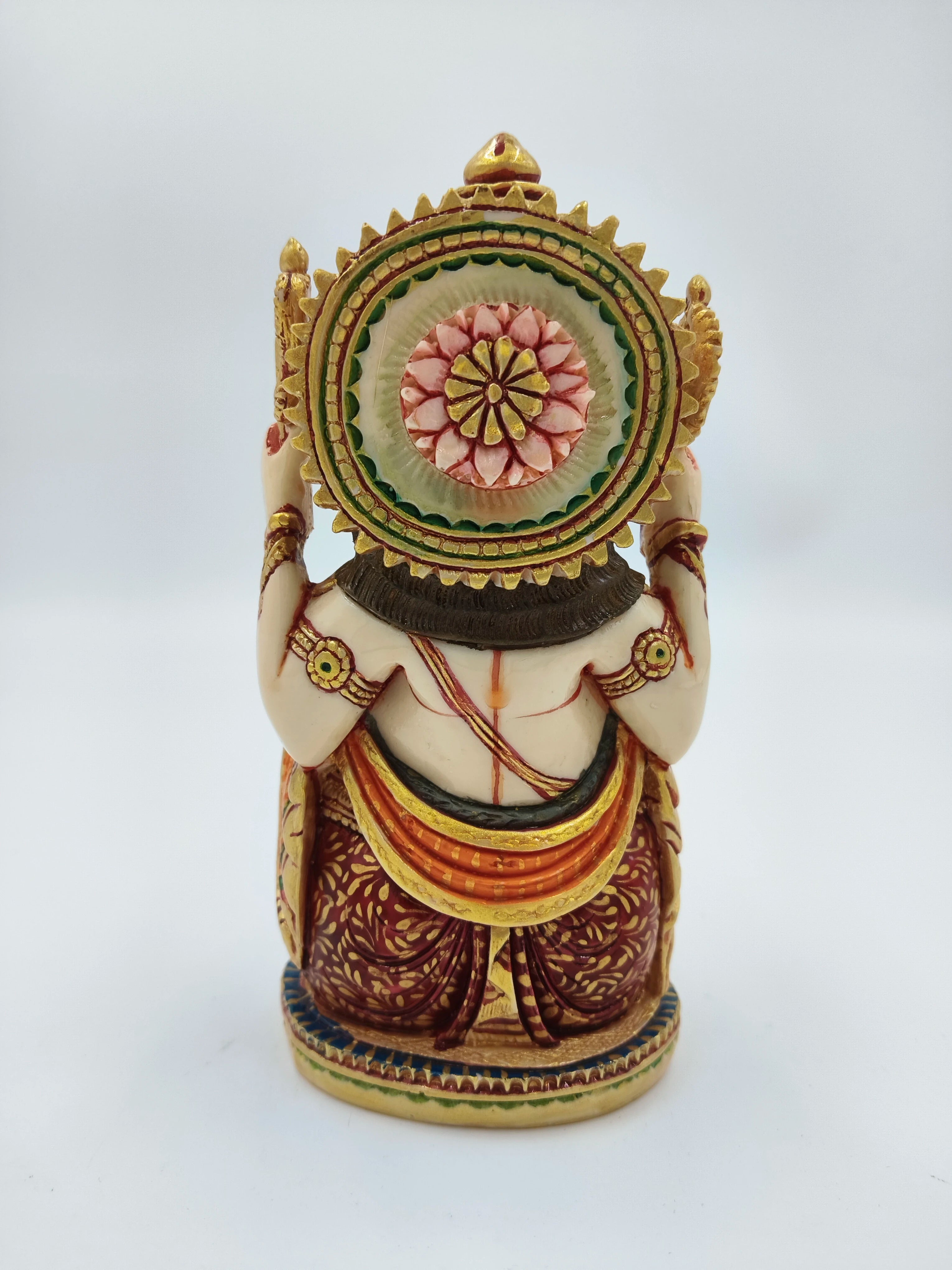 Back view of medium polyresin Ganesh statue with detailed traditional attire