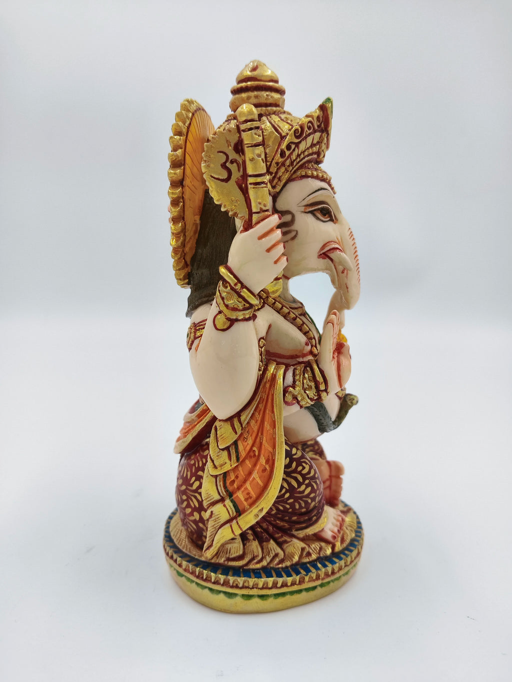 Side view of medium polyresin Lord Ganesh sculpture with detailed painting