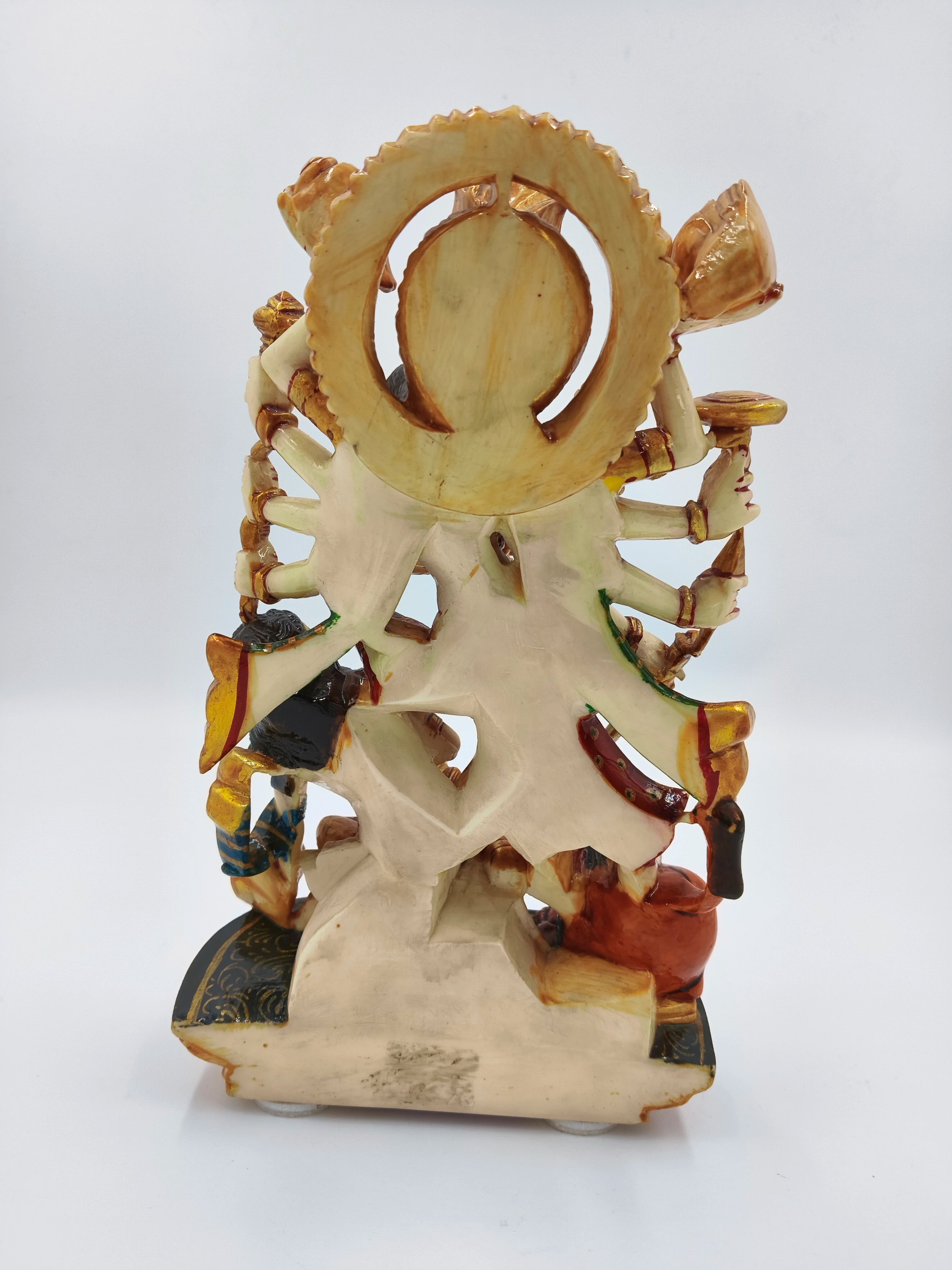 Back view of polyresin sculpture of Hindu goddess Durga with multiple arms and detailed base