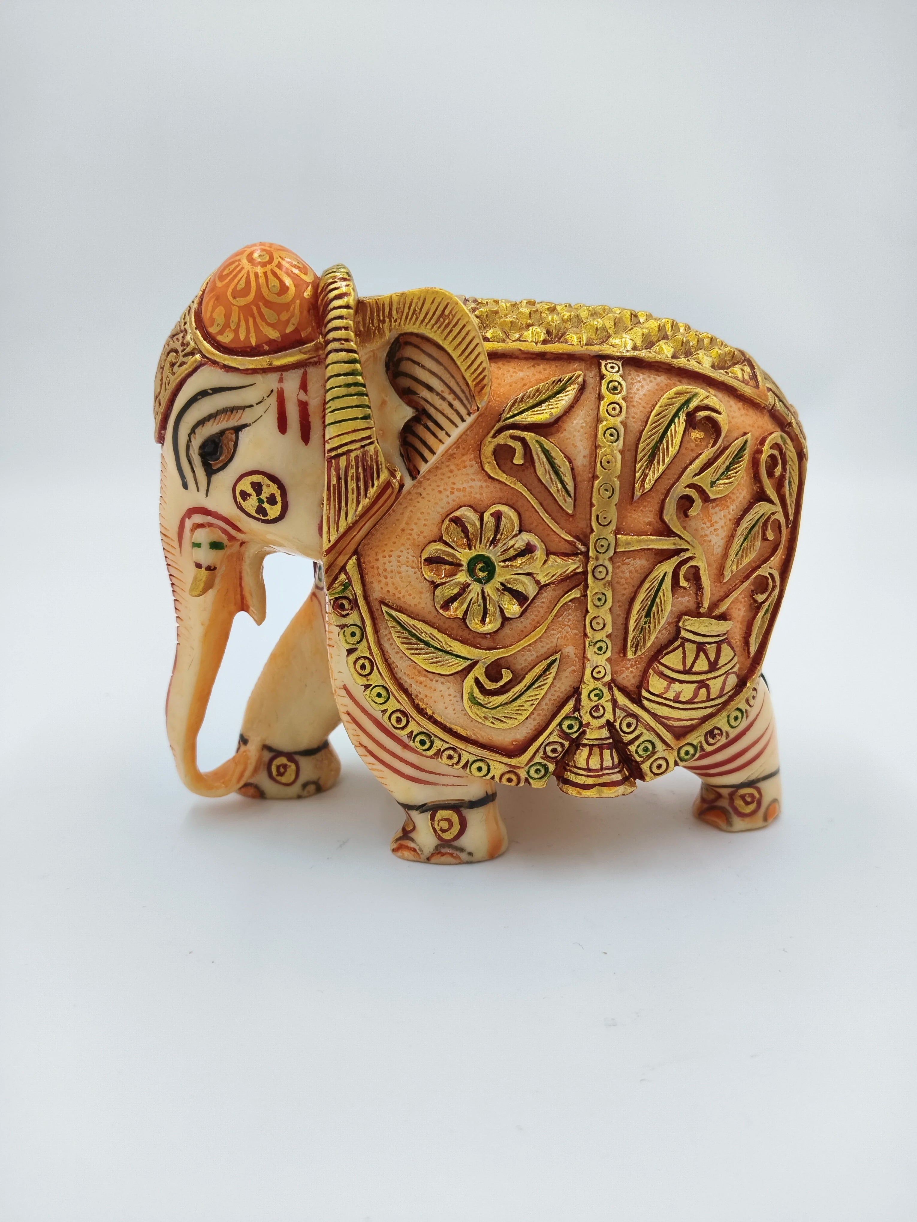 Hand-painted polyresin elephant sculpture with intricate floral designs, side view