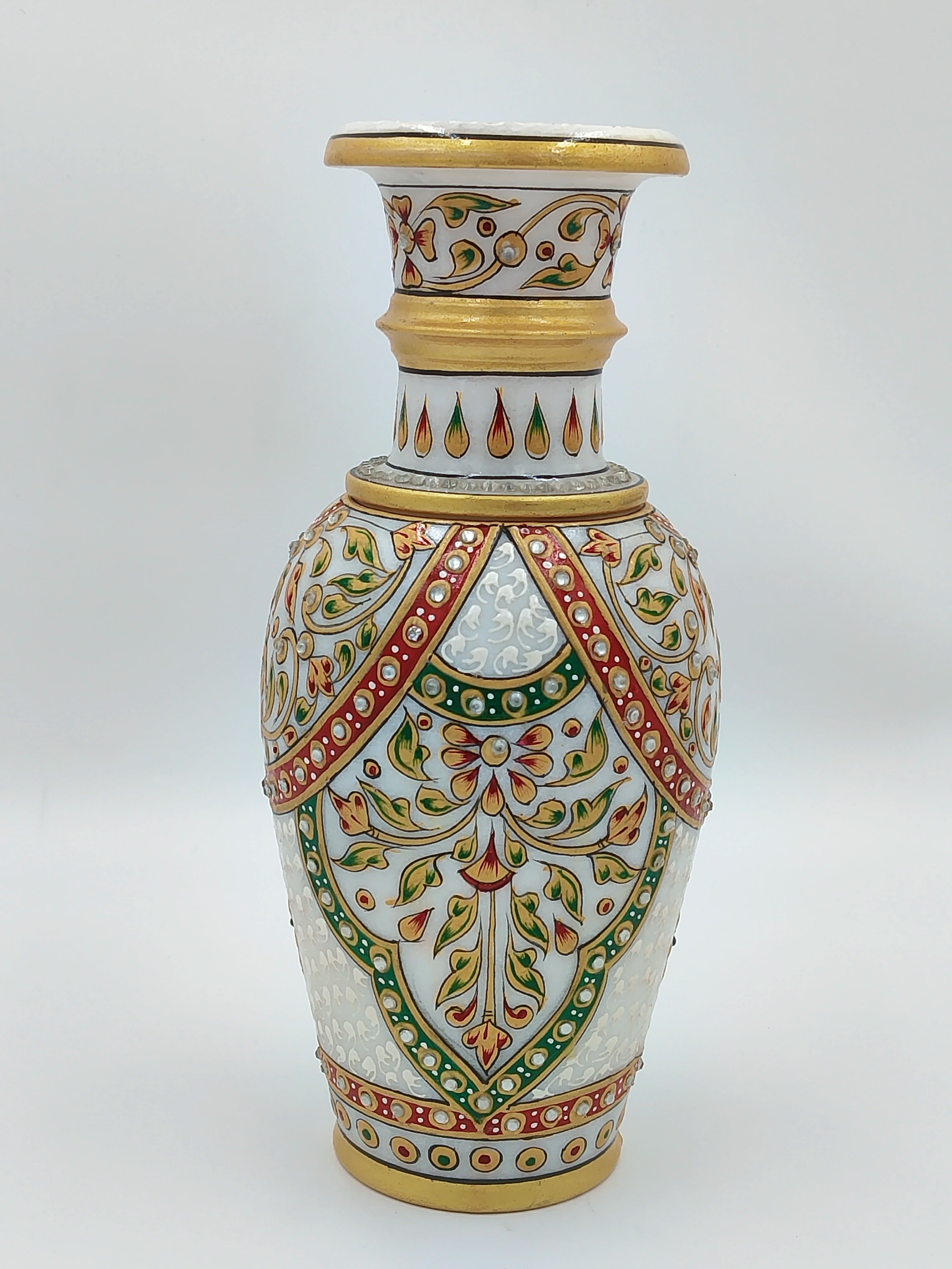 Large marble flower vase with intricate floral and leaf patterns in gold, red, and green