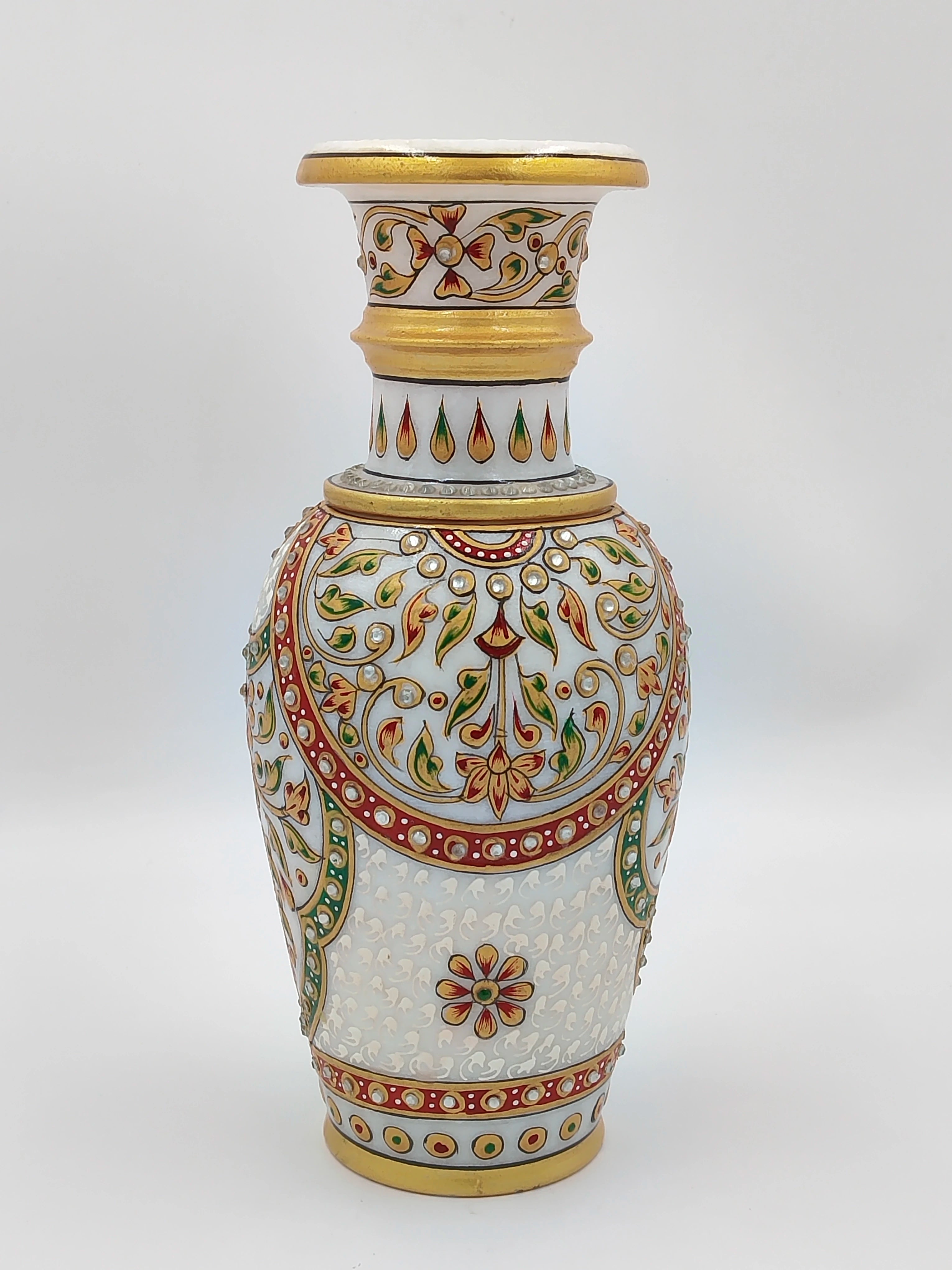 Large white marble flower vase with intricate red, green, and gold floral designs