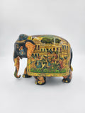 Hand-painted wooden elephant figurine with detailed procession artwork on side