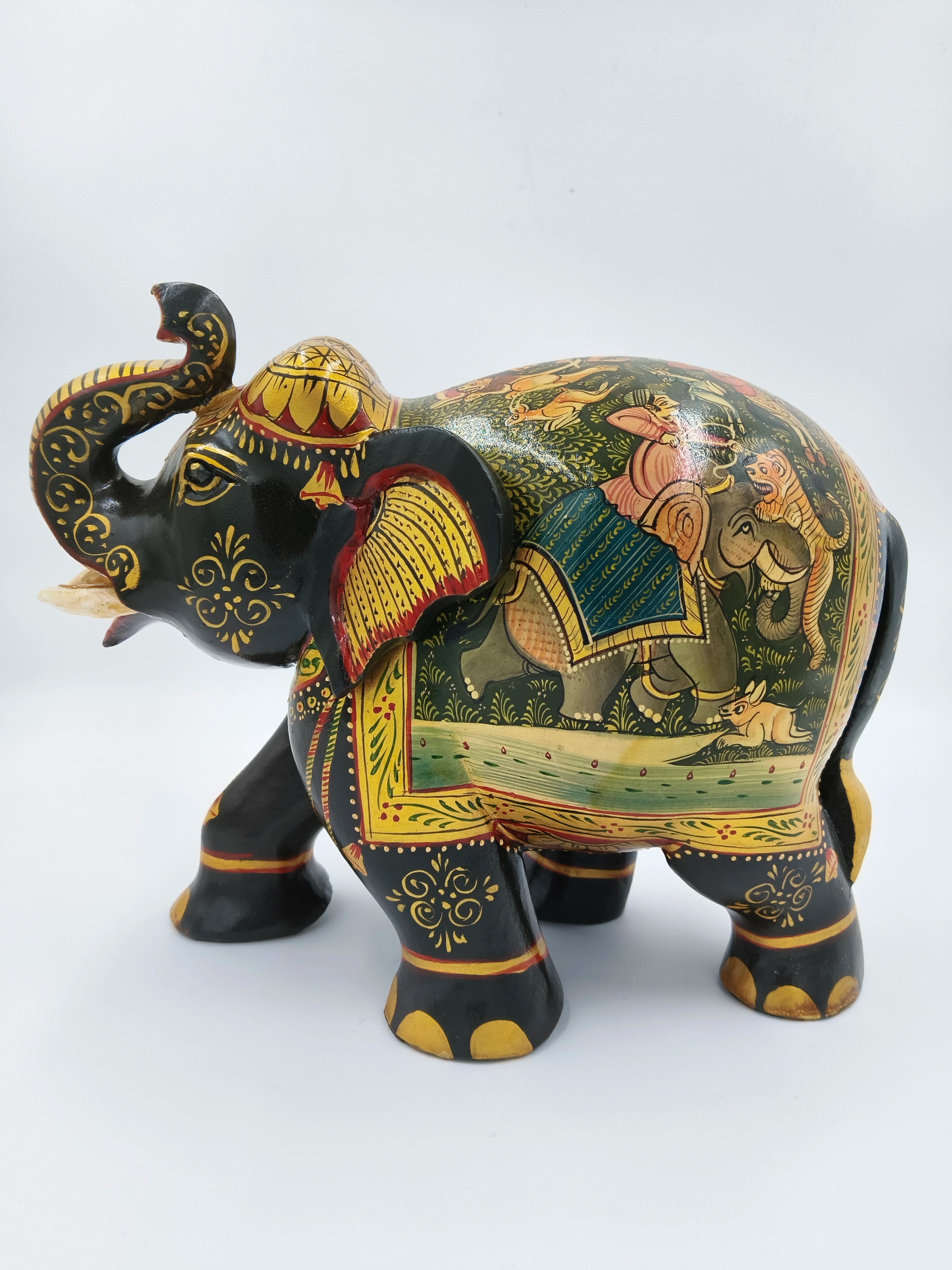 Hand-painted wooden elephant sculpture with intricate traditional designs and figures