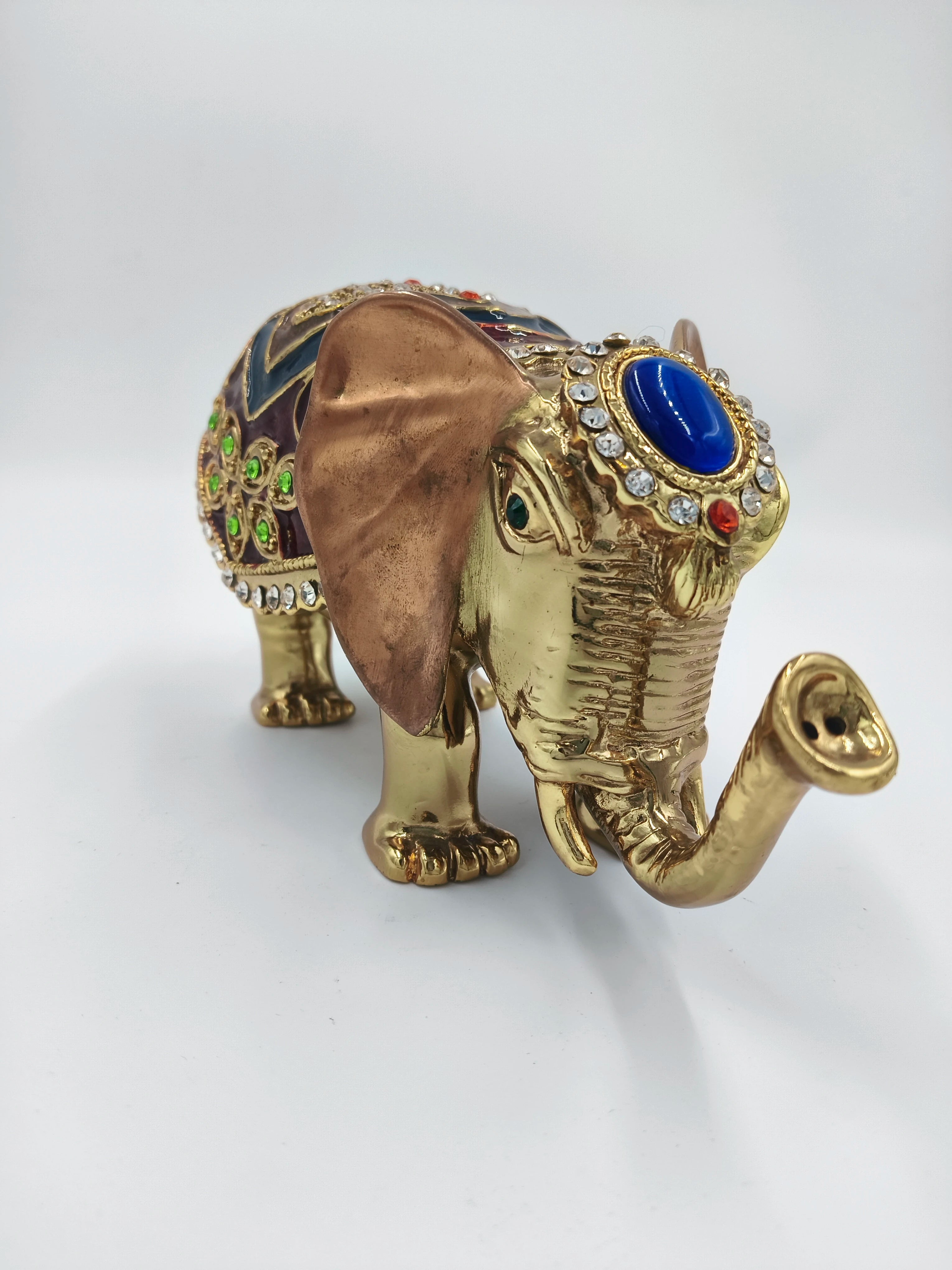 Copper elephant figurine with enamel decoration and gemstone embellishments, side view