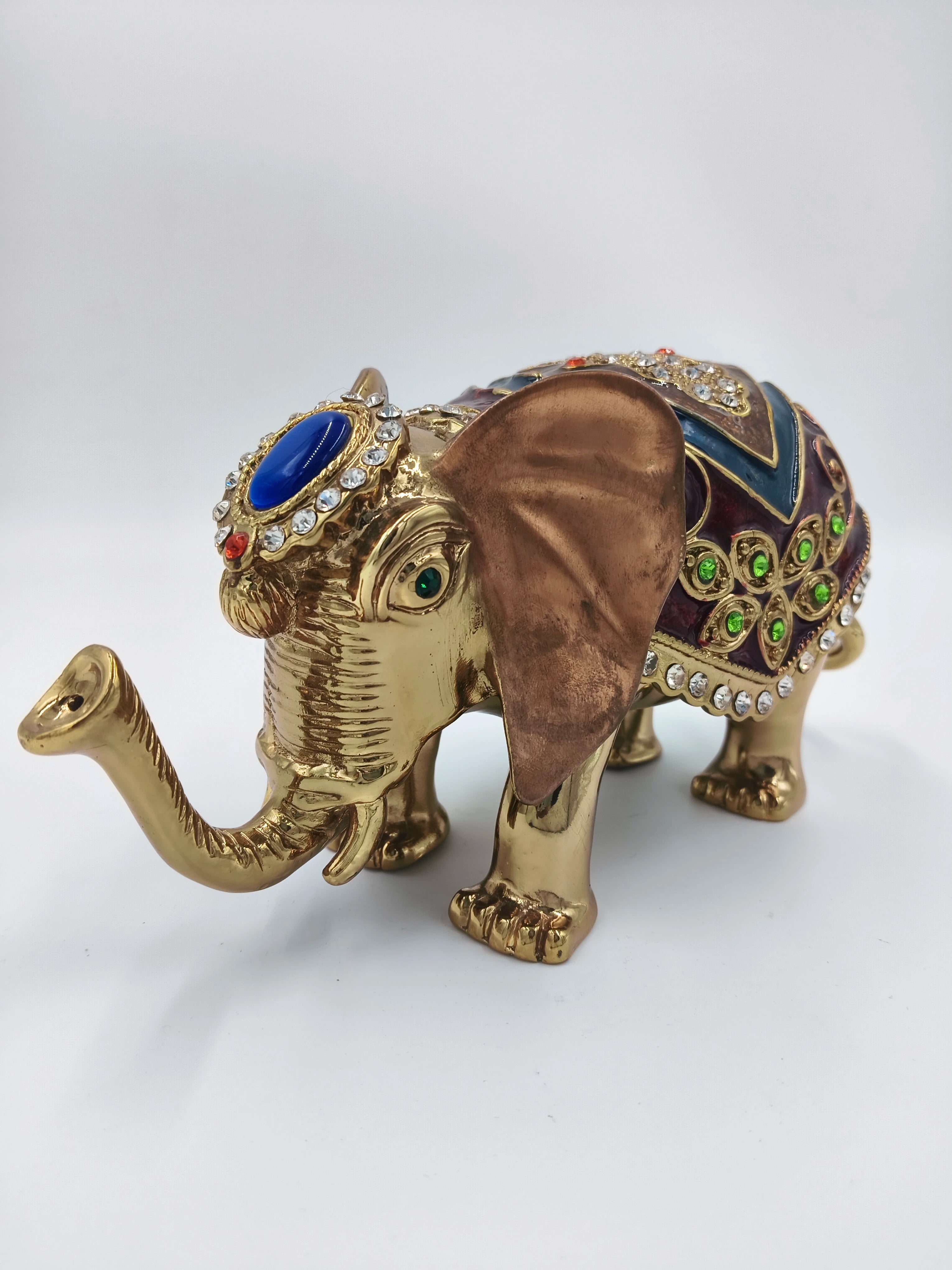 Decorative medium-sized copper enamel elephant figurine with gems and colorful details side view