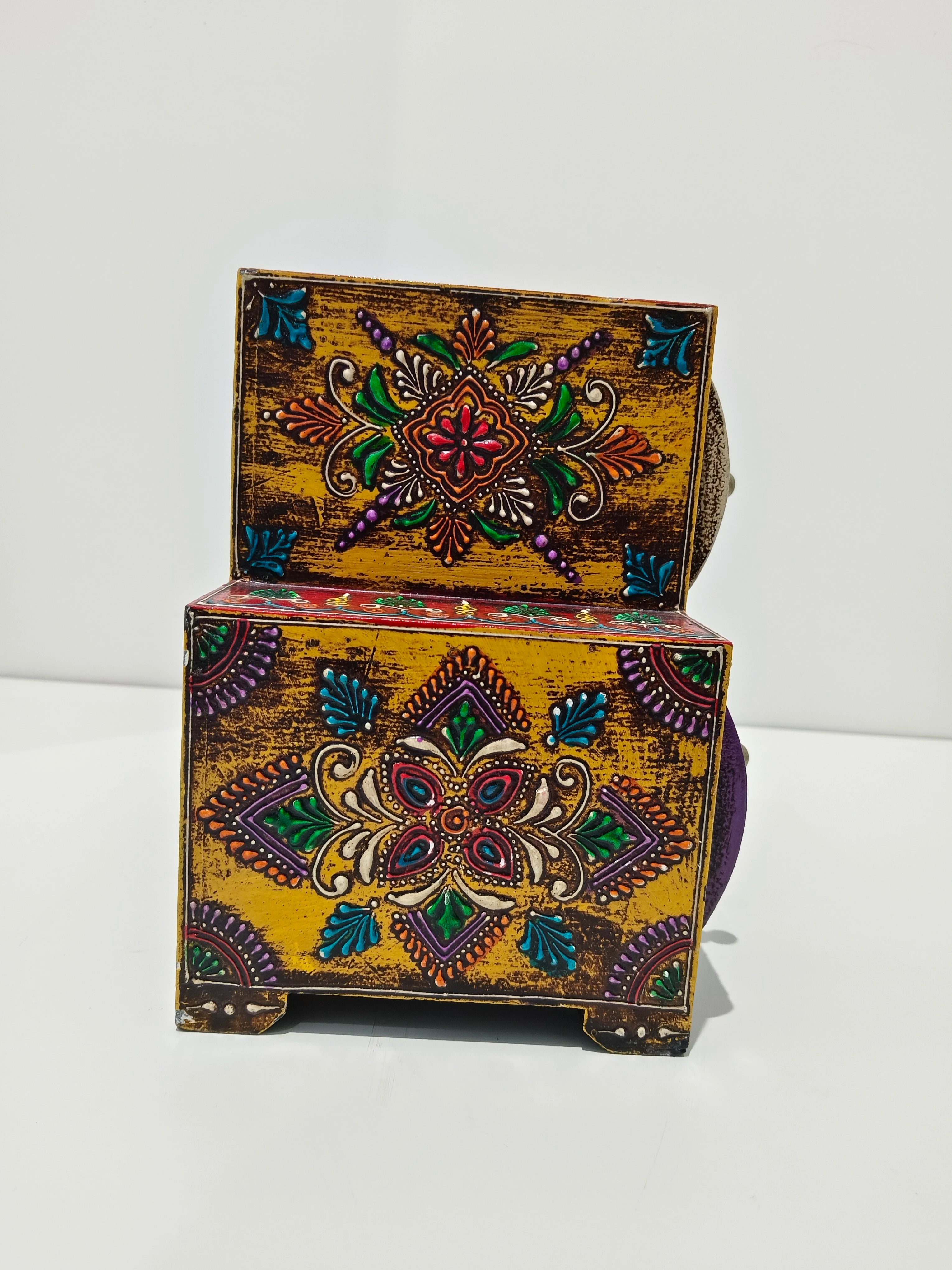 Colorful large wooden spice box with intricate floral patterns and raised designs