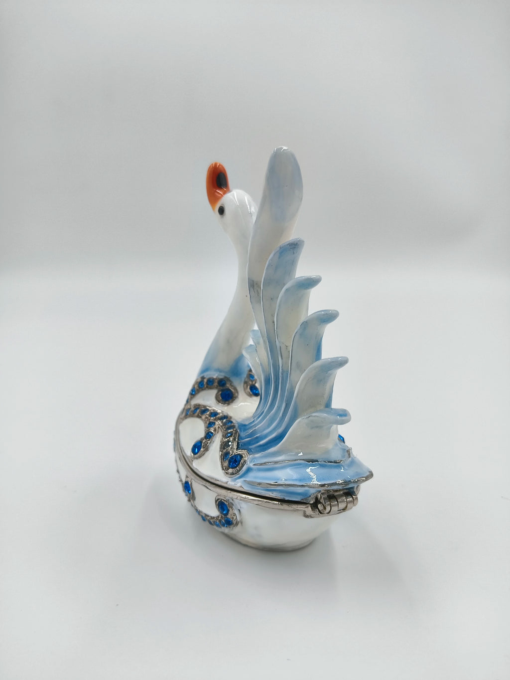 Brass enamel swan figurine with blue artificial stones and detailed wings side view