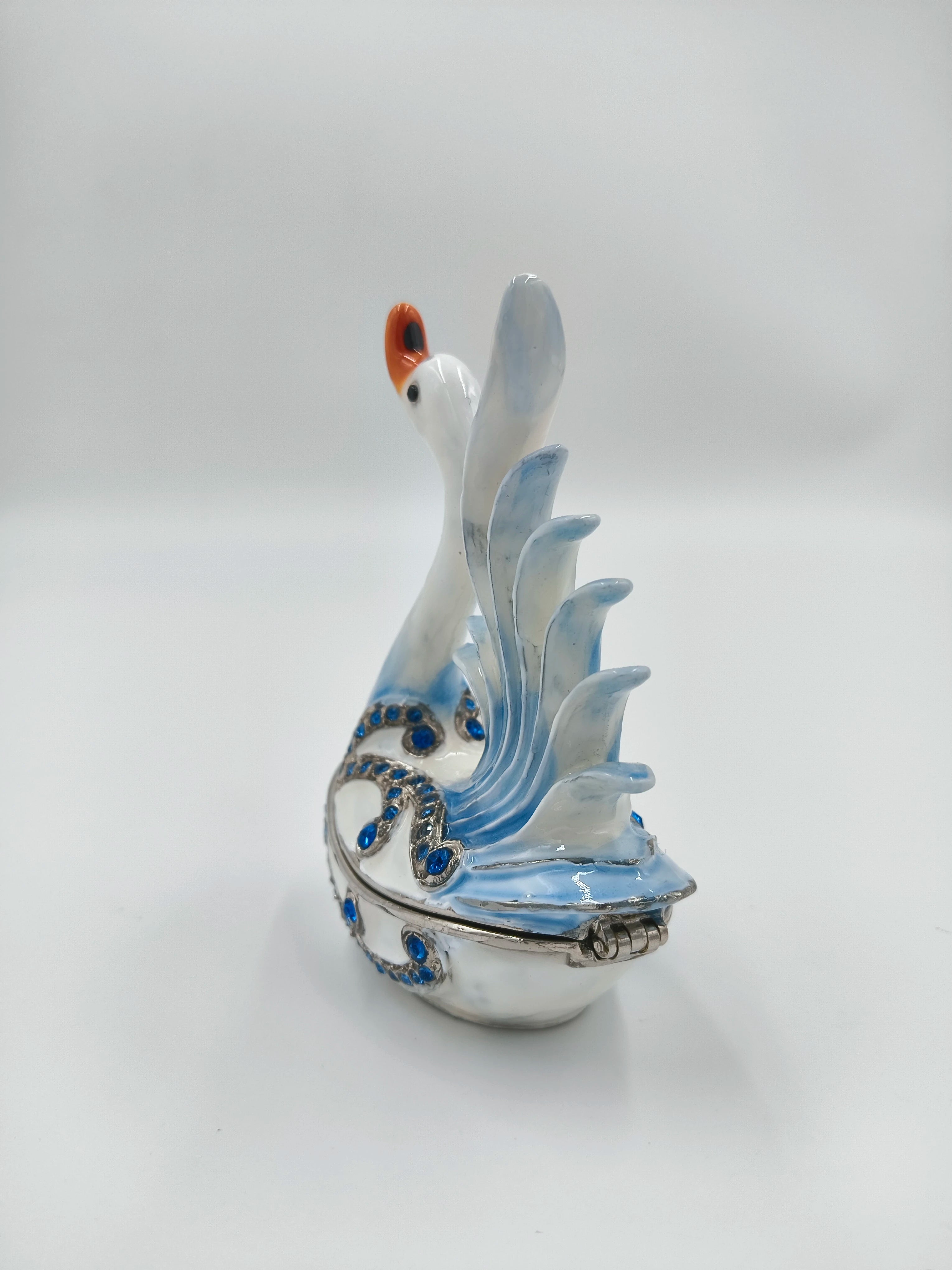 Brass enamel swan figurine with blue artificial stones and detailed wings side view