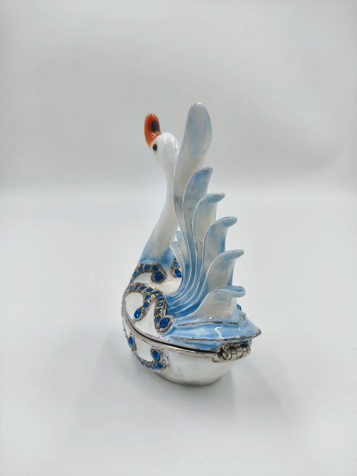 Brass enamel swan figurine with blue artificial stones and detailed wings side view