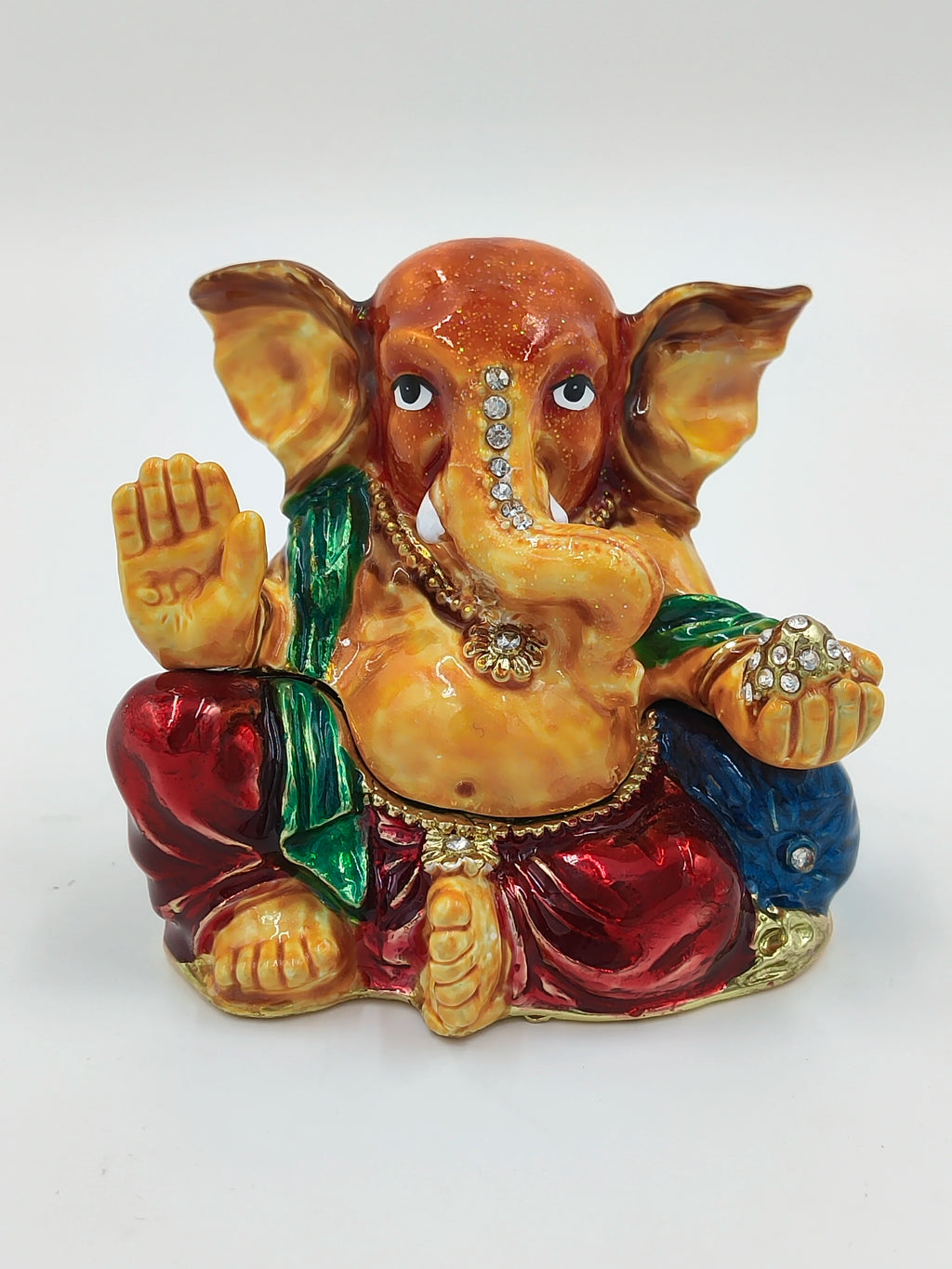Front view of brass enamel Ganesh statue decorated with artificial stones