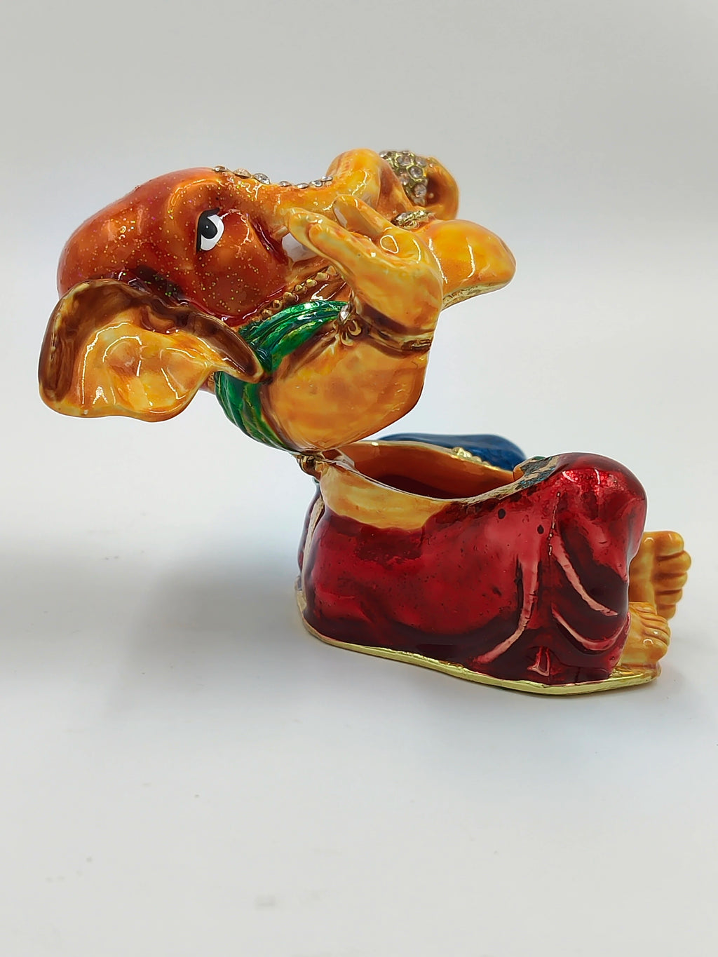 Side view of brass enamel Ganesh sculpture with artificial stones and vibrant colors