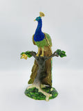 Large brass enamel peacock figurine with stones perched on a tree branch sculpture