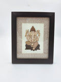 Mini wooden framed art picture of Ganesh with intricate carved details