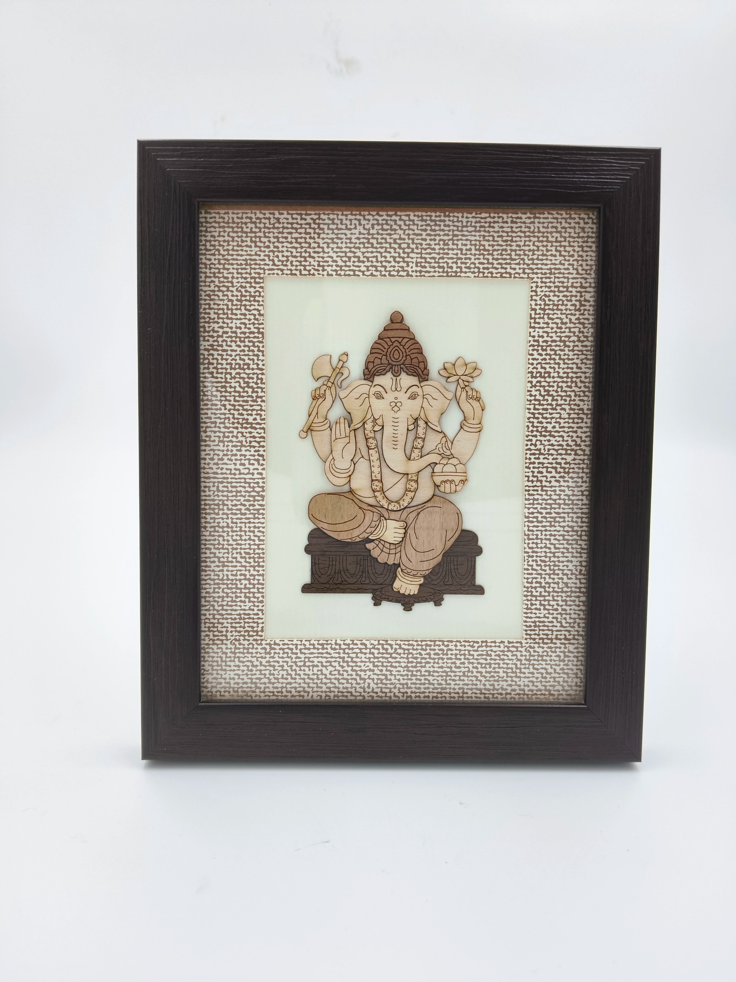 Mini wooden framed art picture of Ganesh with intricate carved details
