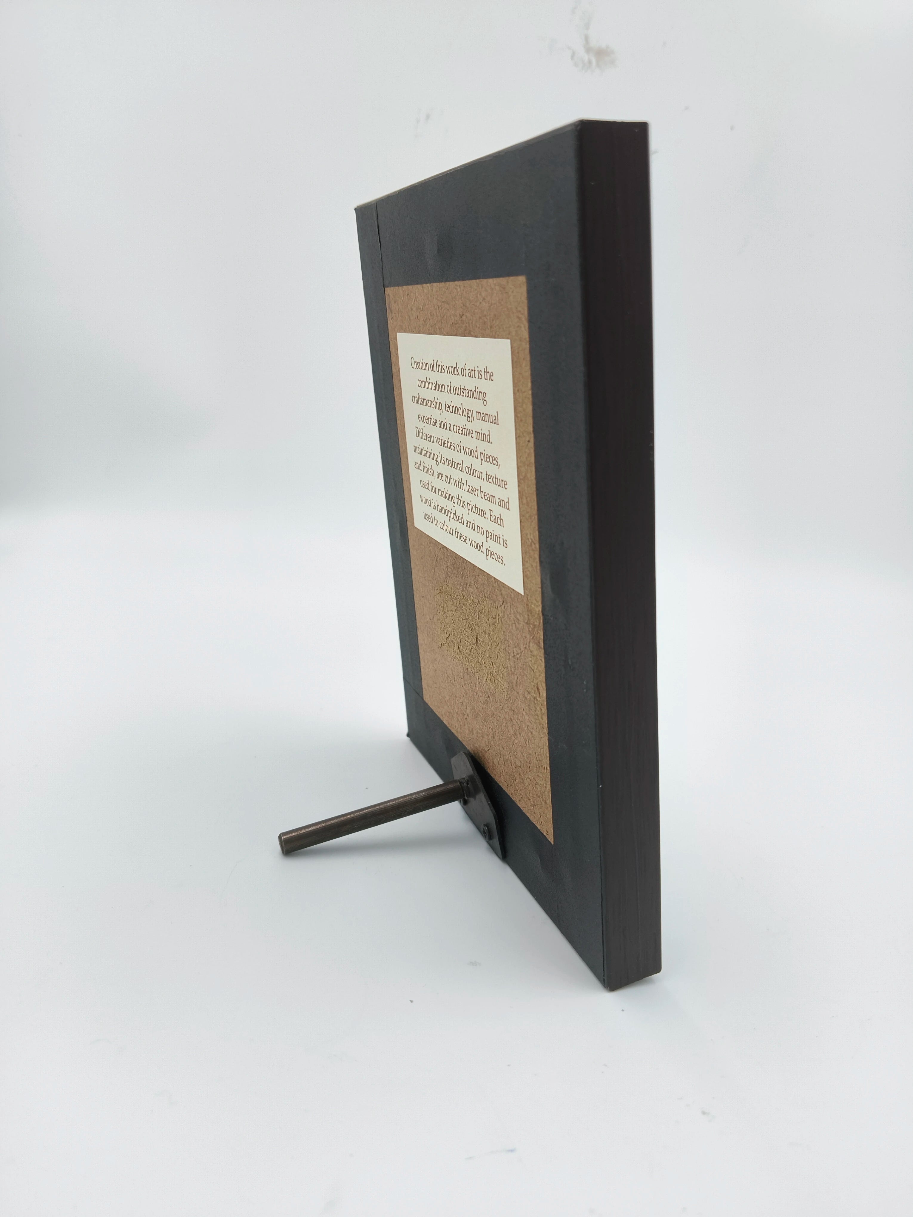 Side view of mini wooden framed art picture with support stand