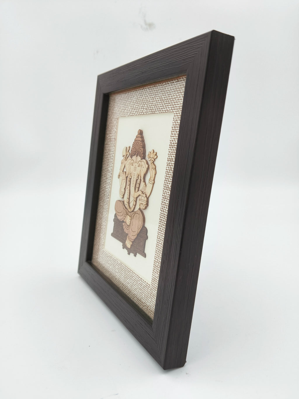 Mini wood art picture of Lord Ganesh in dark wooden frame side view