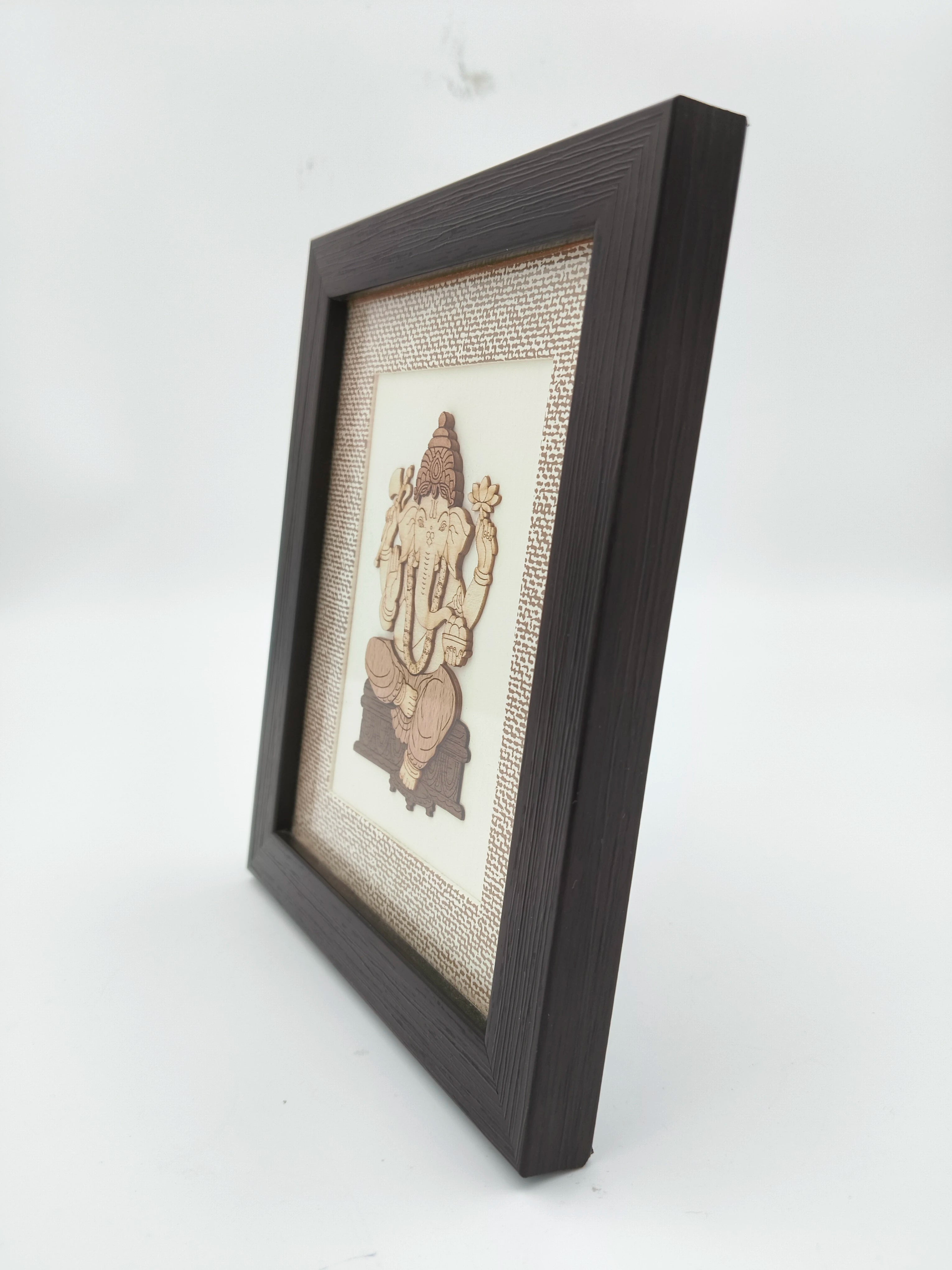 Mini wood art picture of Lord Ganesh in dark wooden frame side view