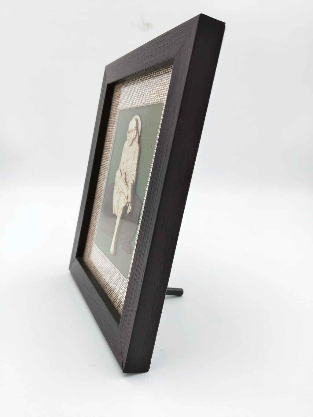 Side view of compact wood art picture frame featuring Shirdi Sai Baba carving