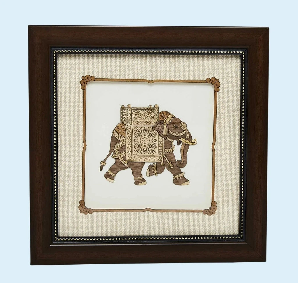 Framed wooden art picture of decorated elephant in intricate carving