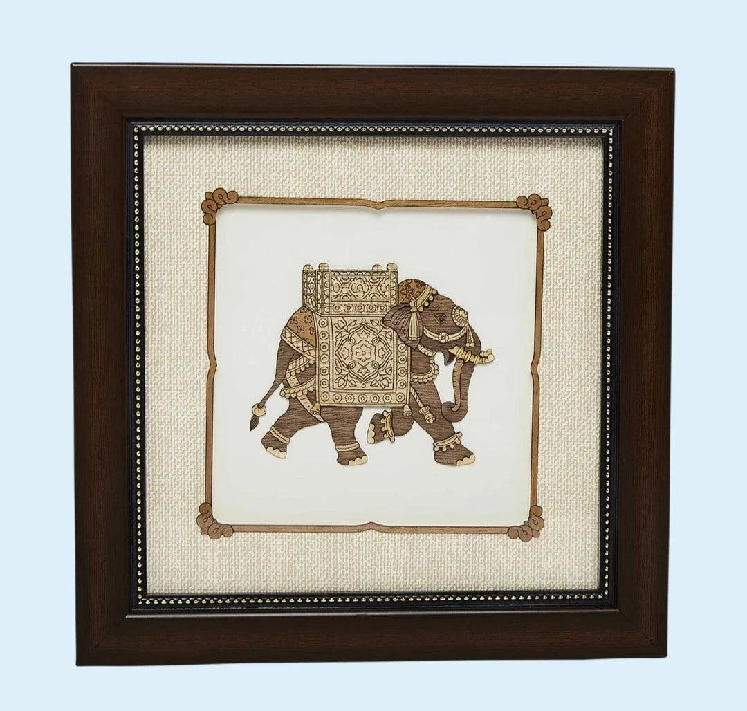 Framed wooden art picture of decorated elephant in intricate carving