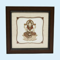 Framed wooden art picture of Goddess Lakshmi seated on a lotus flower
