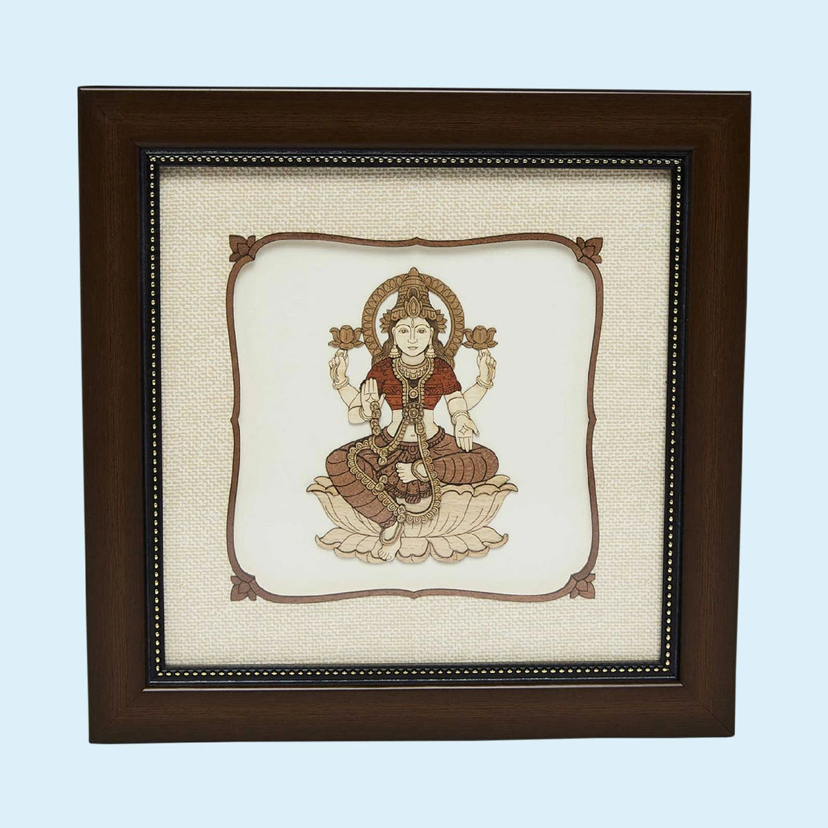 Framed wooden art picture of Goddess Lakshmi seated on a lotus flower